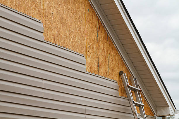 Professional Emergency Siding Repair technician working in Ridgeway, OH